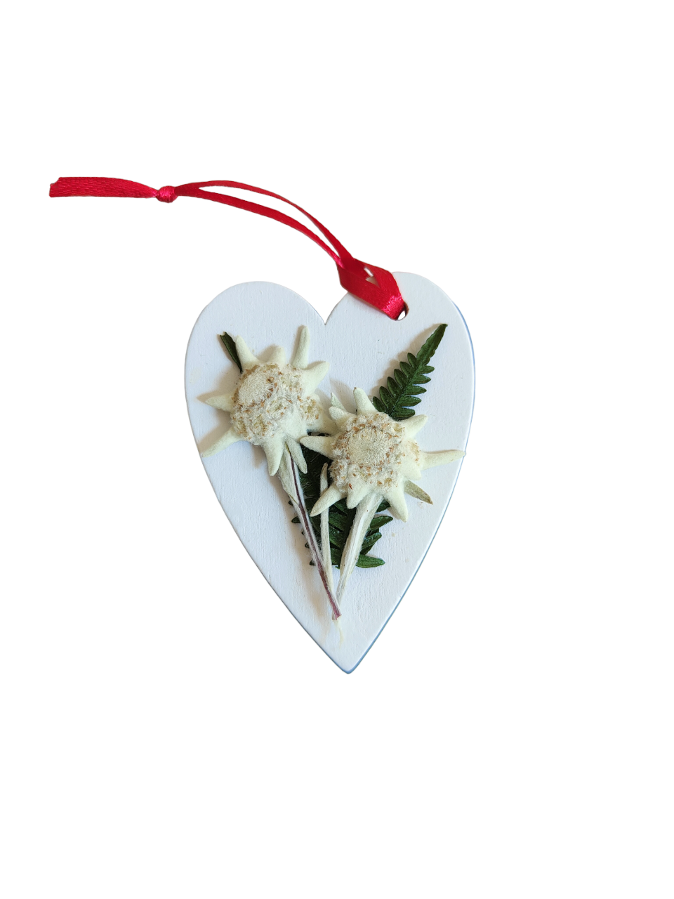 White heart decorated by hand with real edelweiss