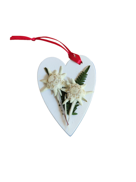 White heart decorated by hand with real edelweiss