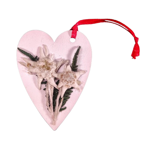 White heart decorated by hand with real edelweiss